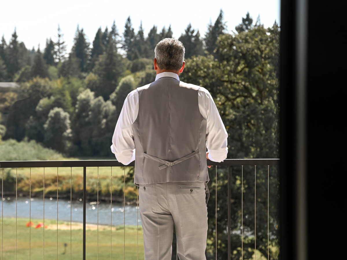 A guest looking out over the river before a ceremony