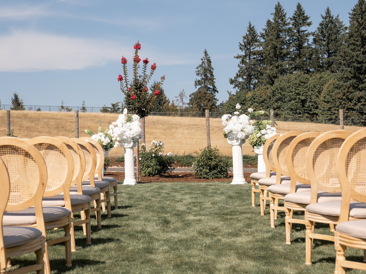 The ceremony aisle looking toward columns of white hydrangea