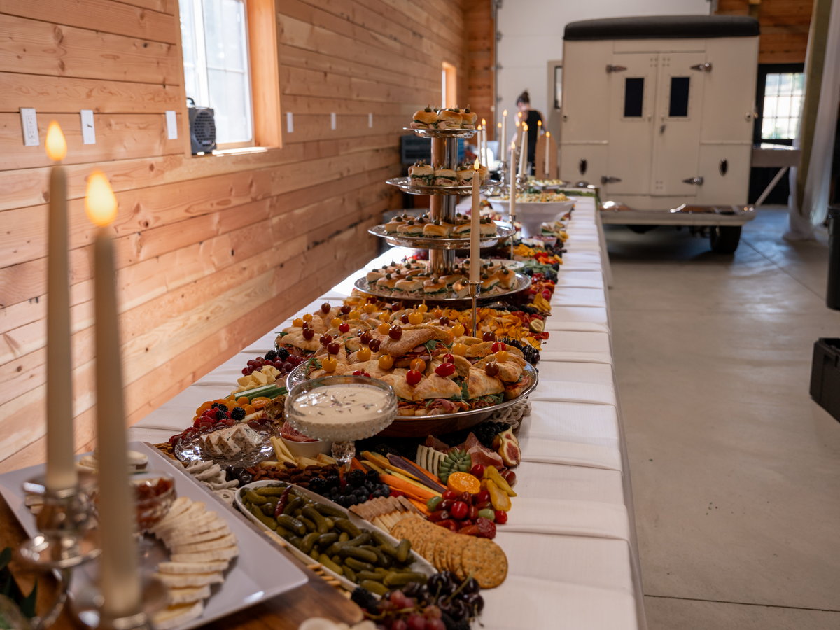 A long grazing table running the length of the barn wall